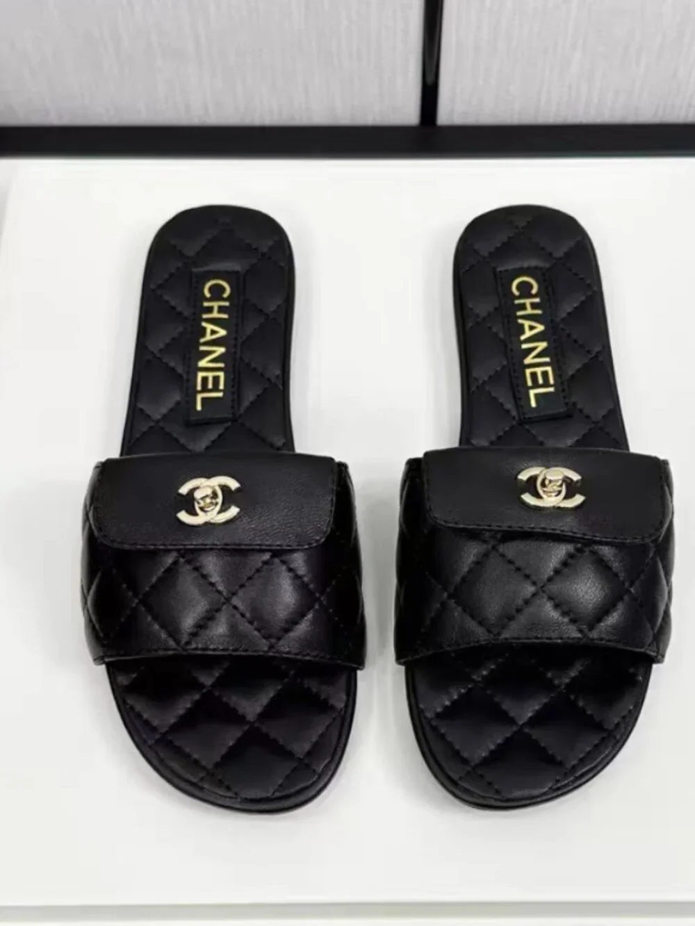 Chanel Black Quilted Lambskin CC Turn‑Lock Flat Slide Sandals